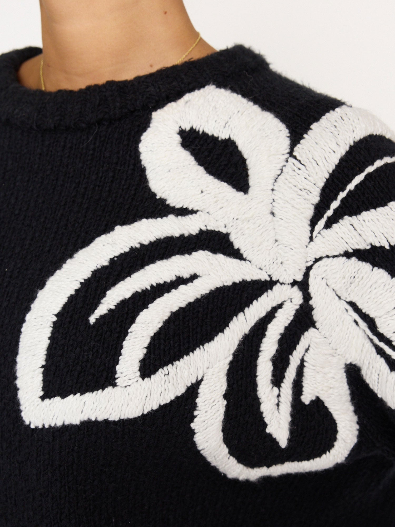 Hibiscus black embroidered crewneck sweater detail closeup view