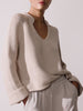 Aria stand collar deep v neckline beige sweater front view 2