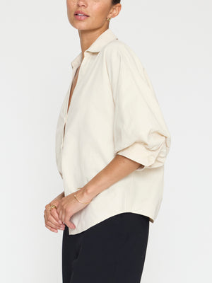 Kate V-neck button up beige shirt side view