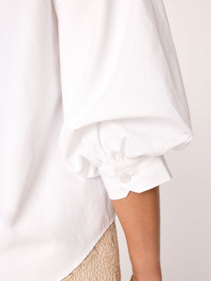 Kate V-neck button up white shirt close up